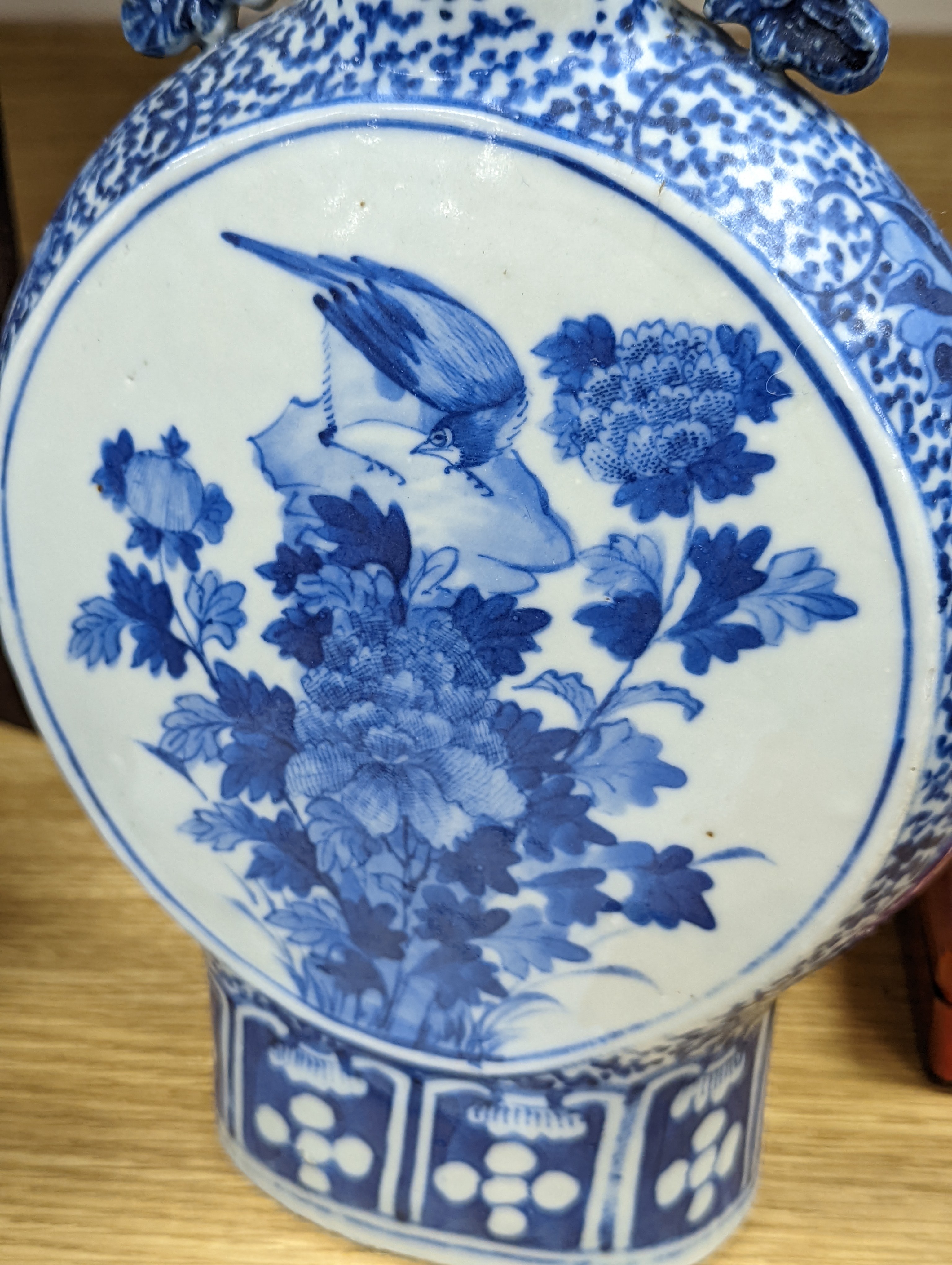 Three 19th century Chinese blue and white Moon flasks, tallest 31 cms.